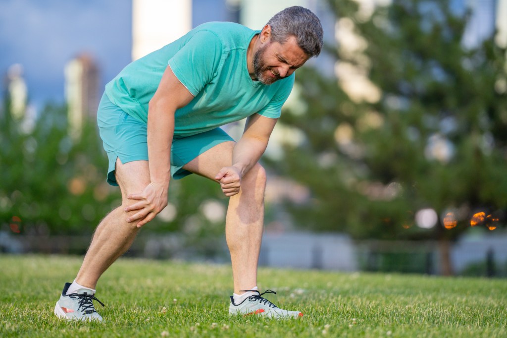 The man who experiences pain in the knee while exercising outdoors.
